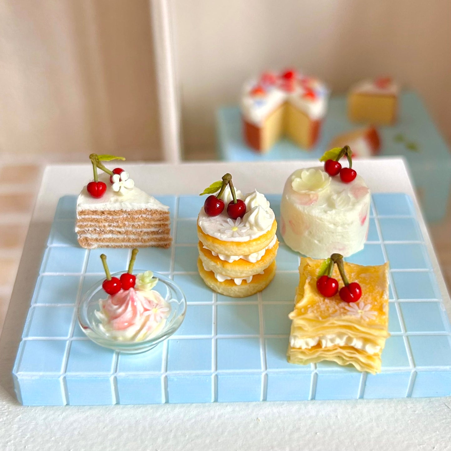 miniature bakery cake display with round layered cake