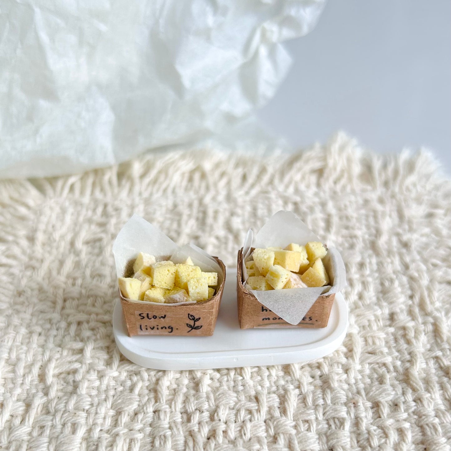 handmade miniature baguette pieces in a small paper box
