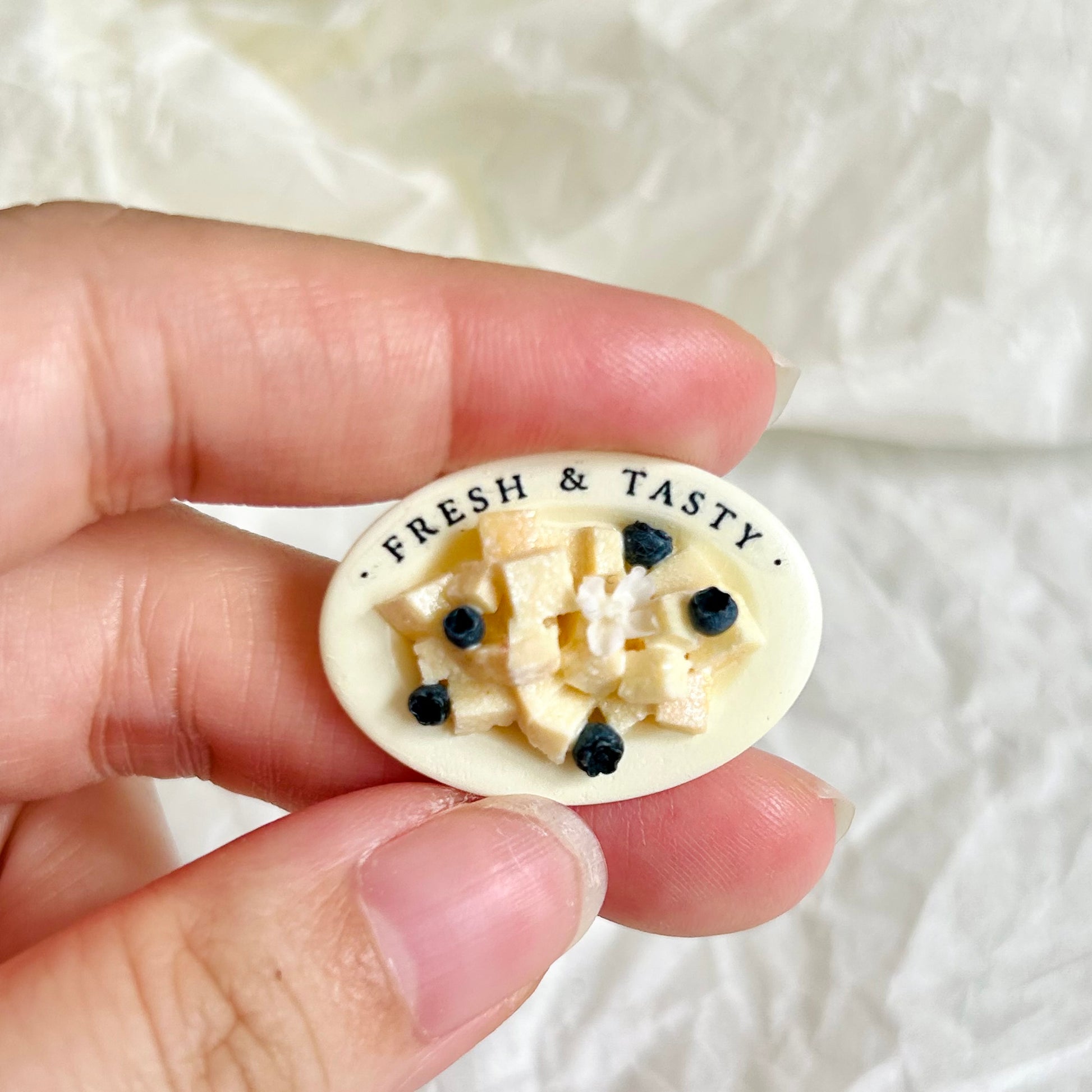 handmade miniature bread dessert held in hand