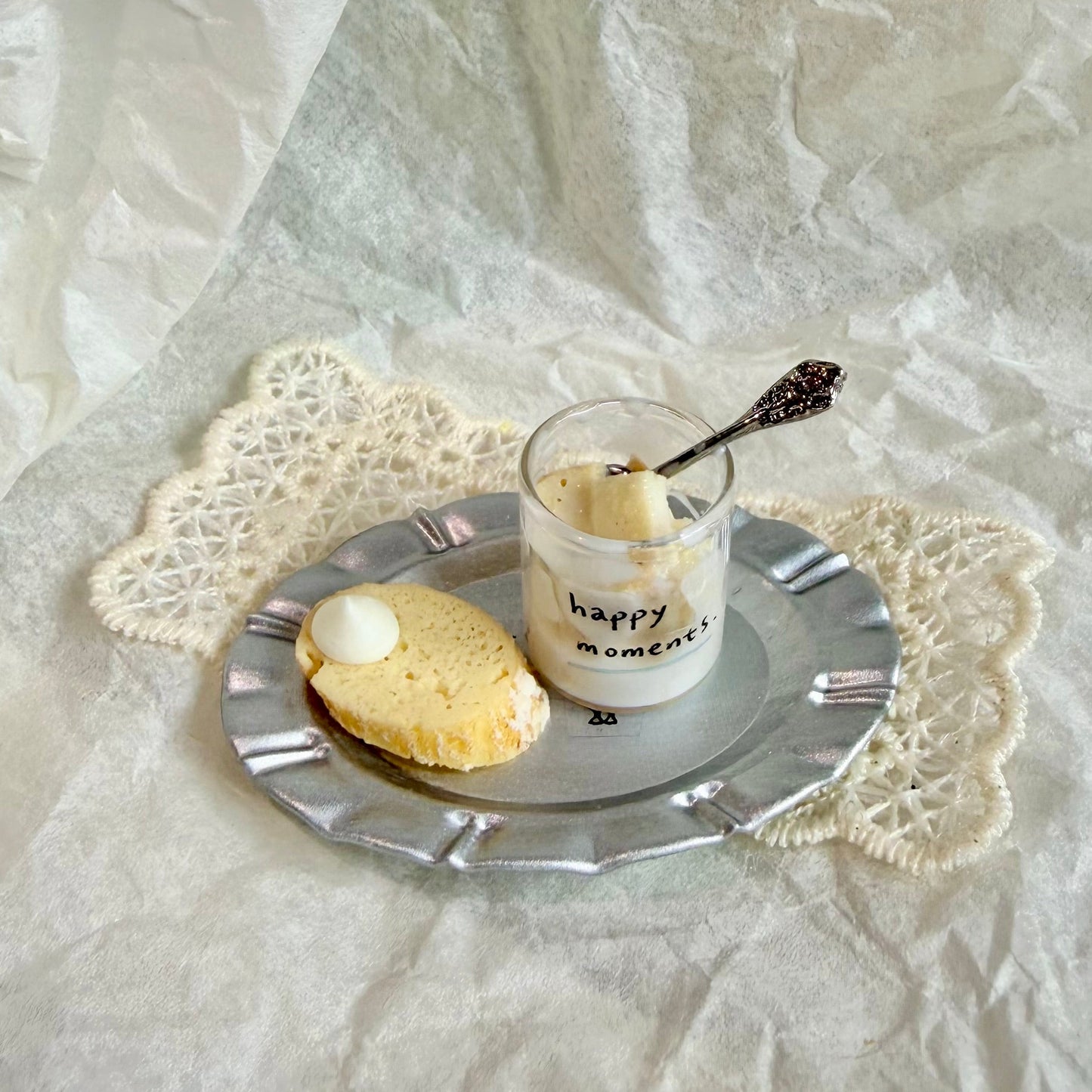miniature glass cup filled with condensed milk bread pieces and toast slice