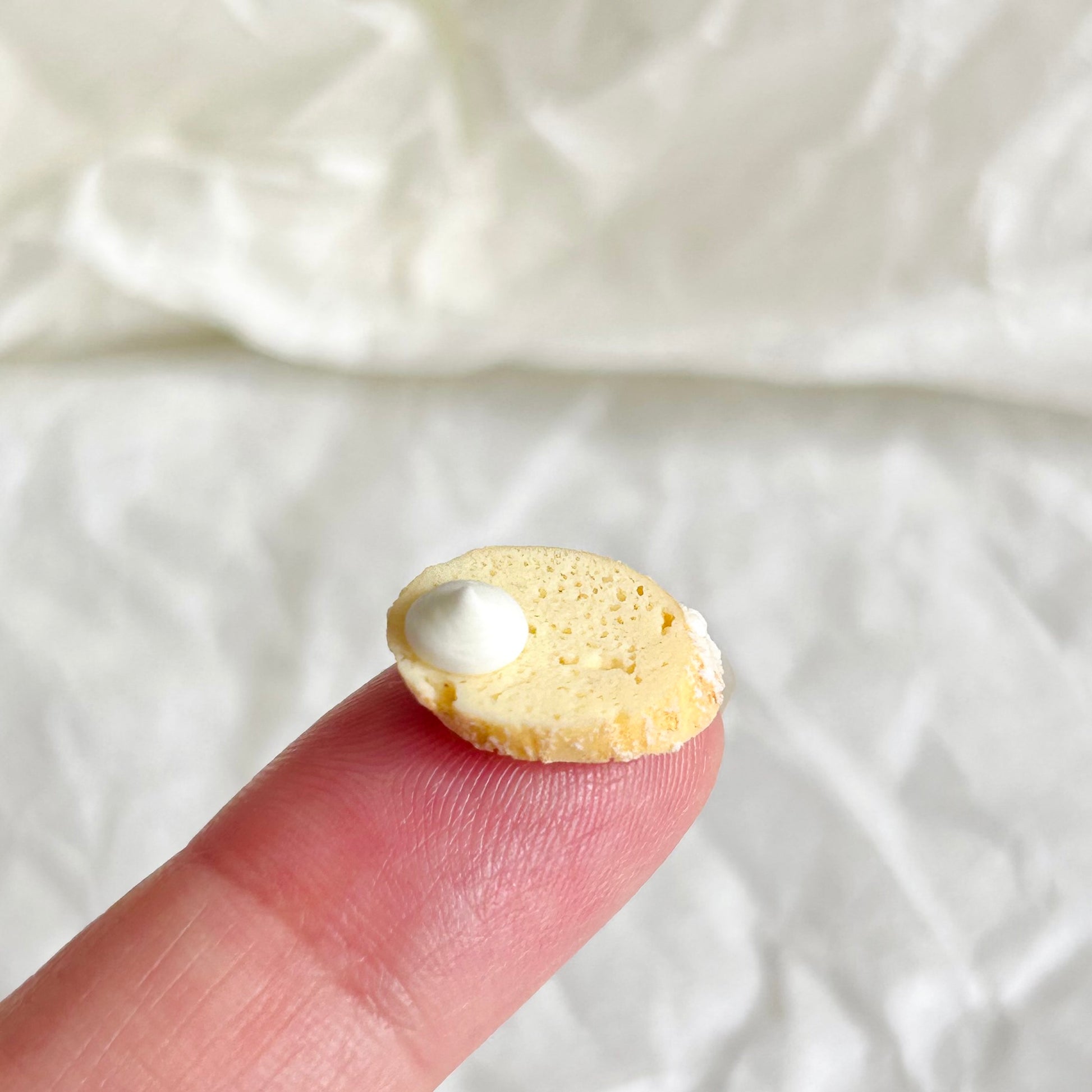 handmade miniature toast slice with cream topping