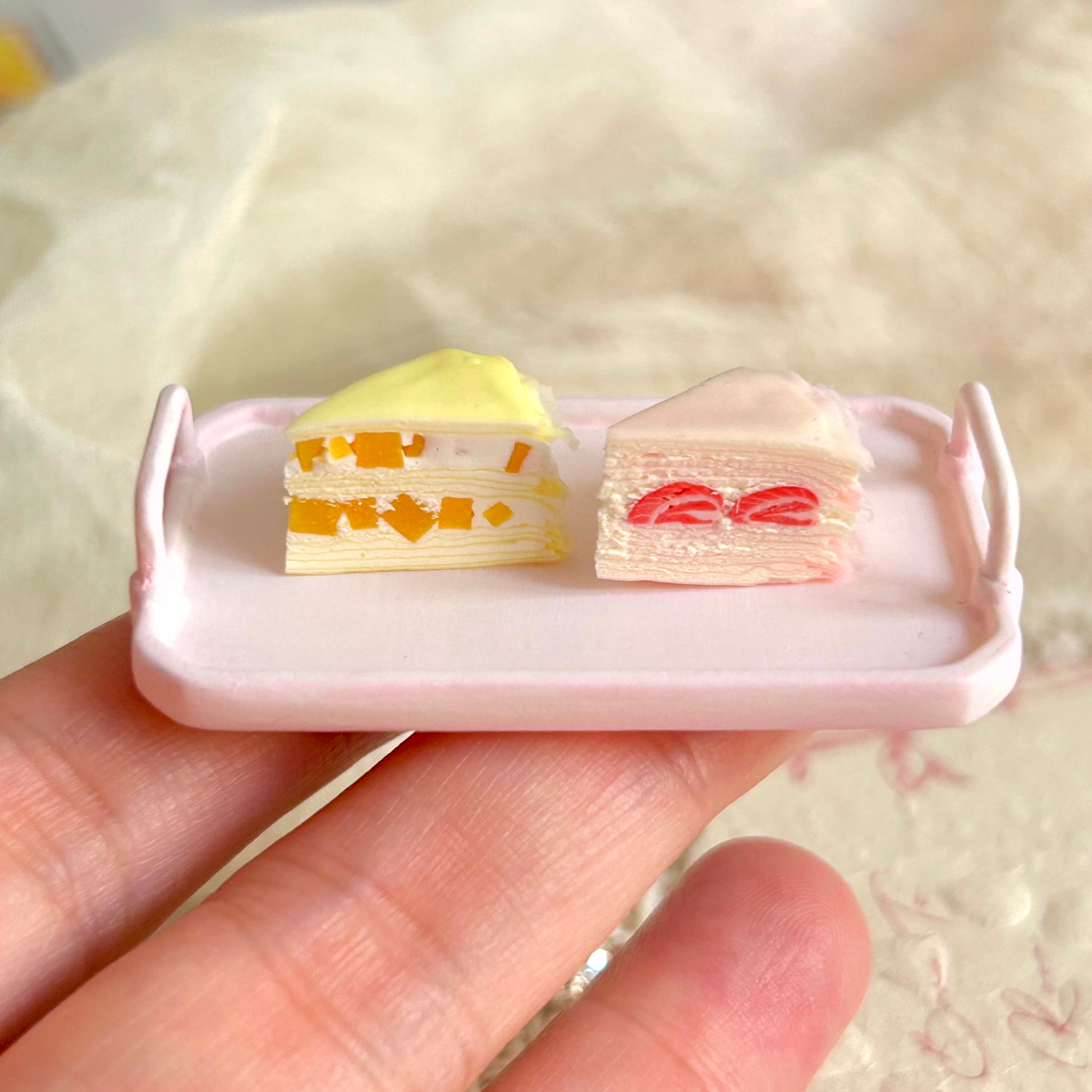 realistic miniature mille crepe cake with fruit filling and cream layers
