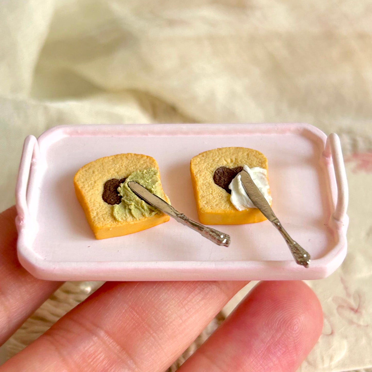 miniature cake slice showing colorful center flower and heart design
