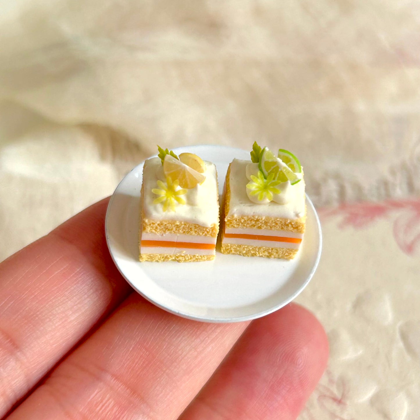 small scale handmade miniature citrus cake held in hand