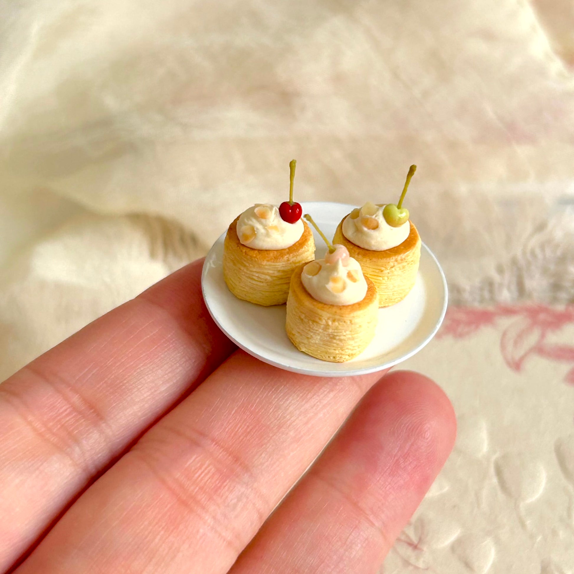 realistic miniature pastry with cream cherry and almond details