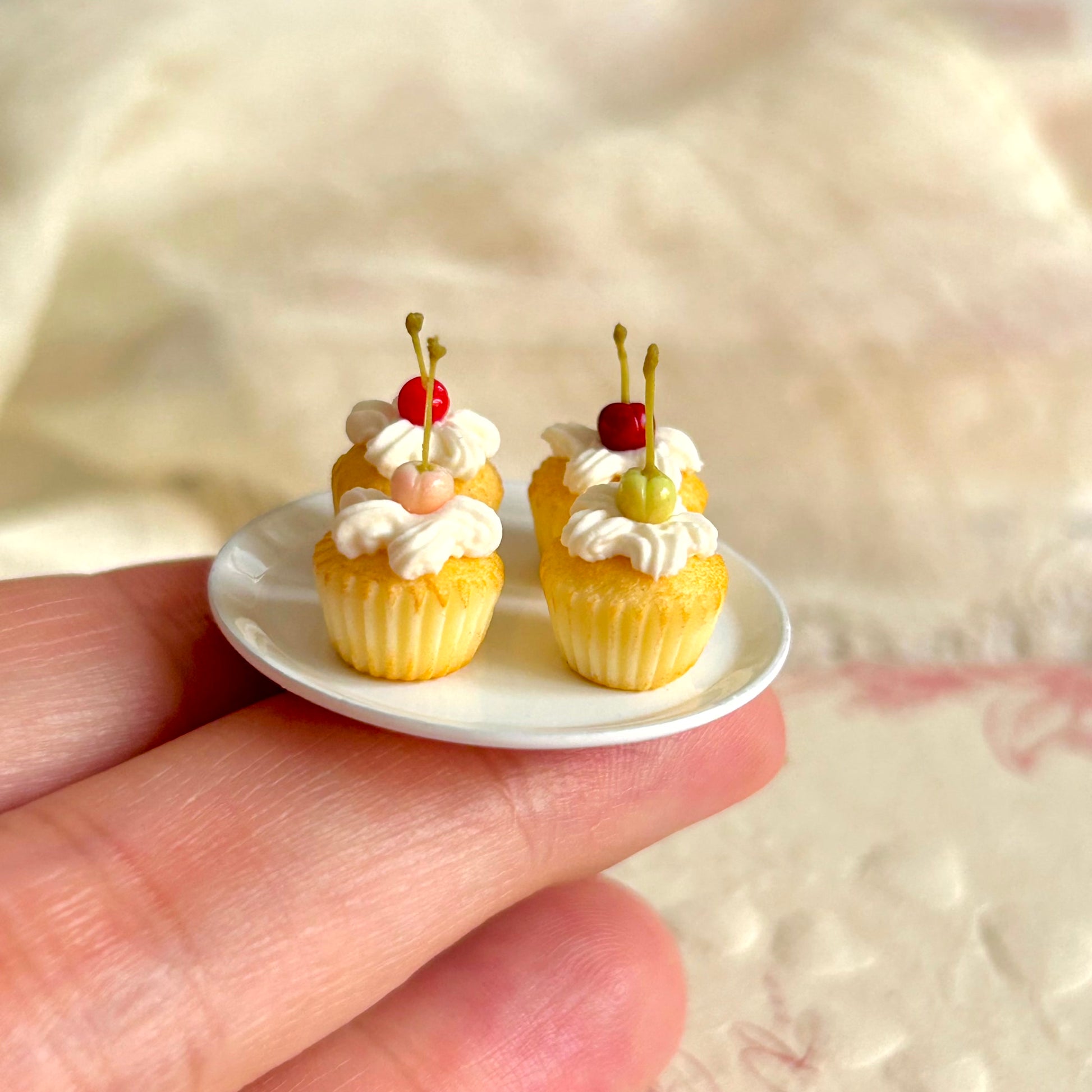 realistic miniature cupcake with cream and cherry decoration details