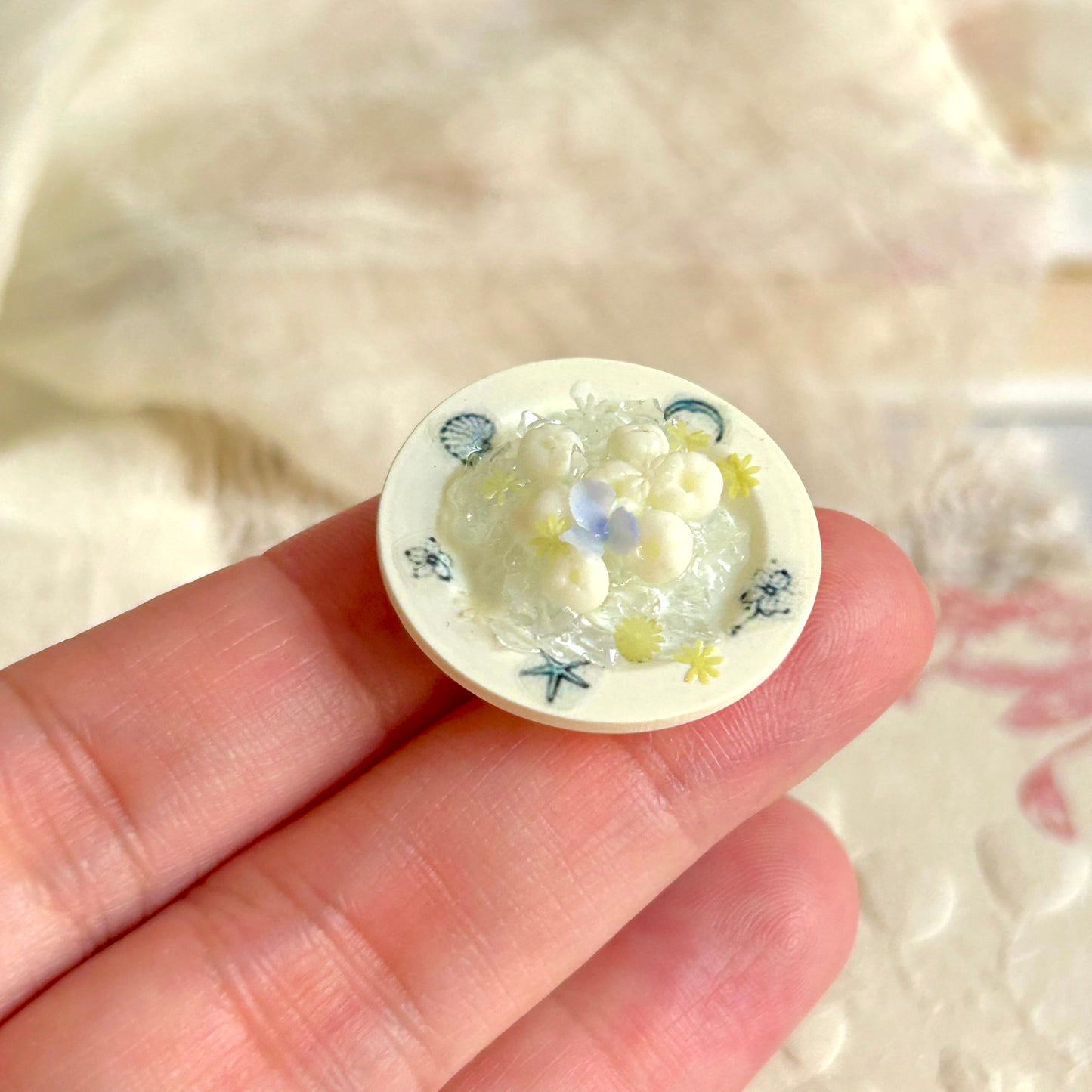 realistic miniature lychee with ice cubes and floral decorations