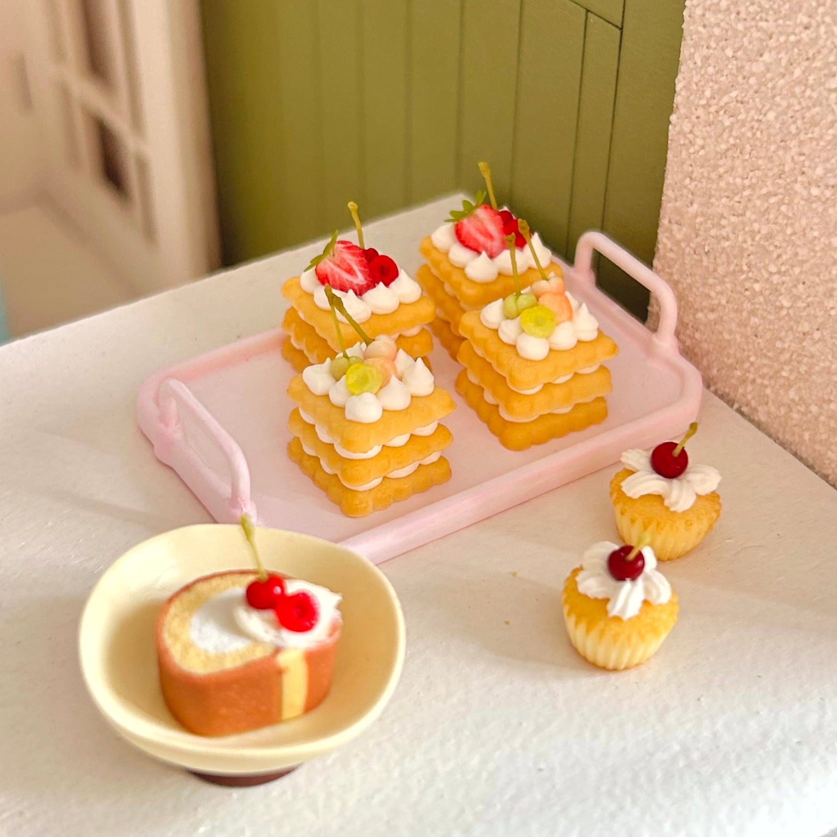 miniature dessert display featuring handmade cherry cookie cake