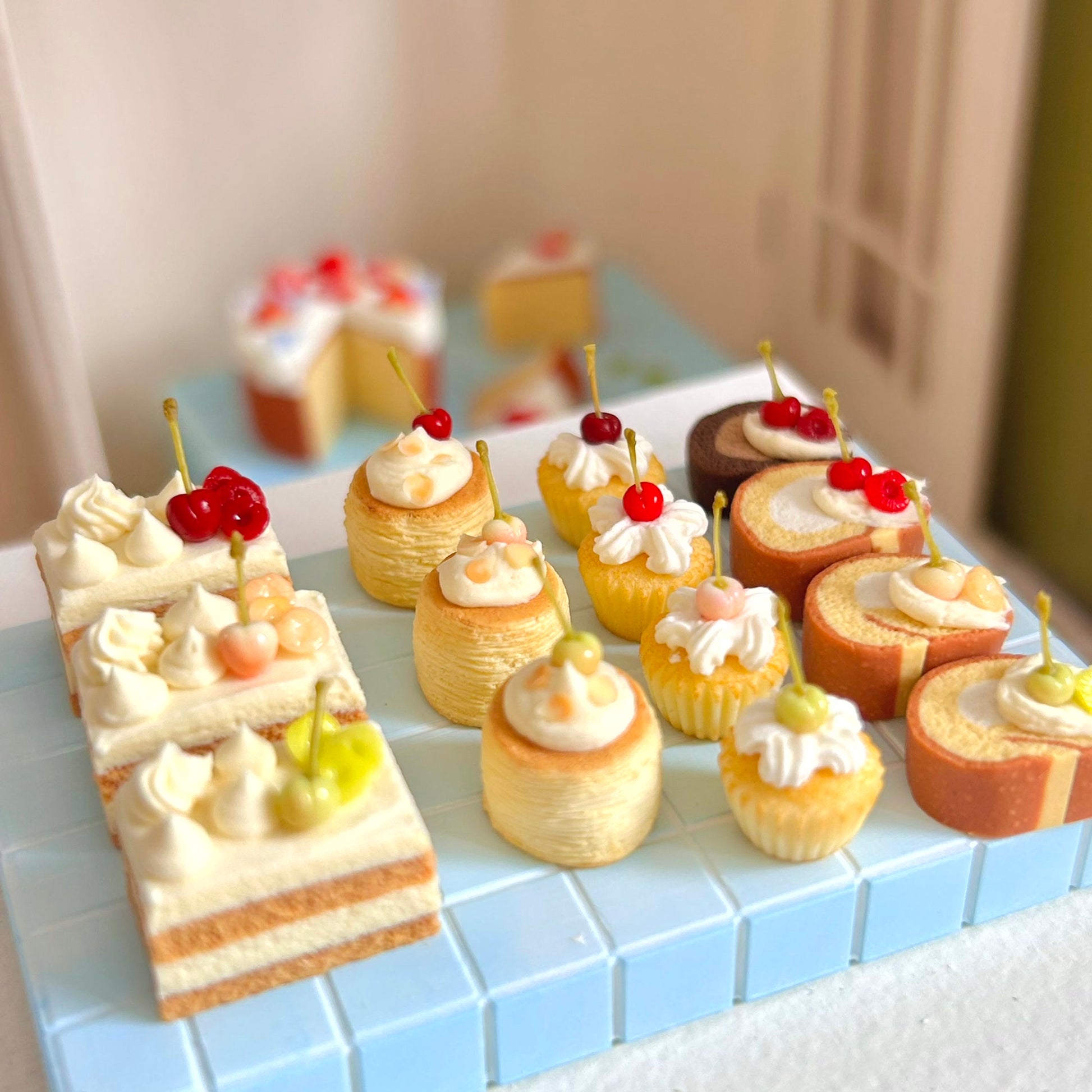 miniature dessert display featuring cherry swiss roll cake
