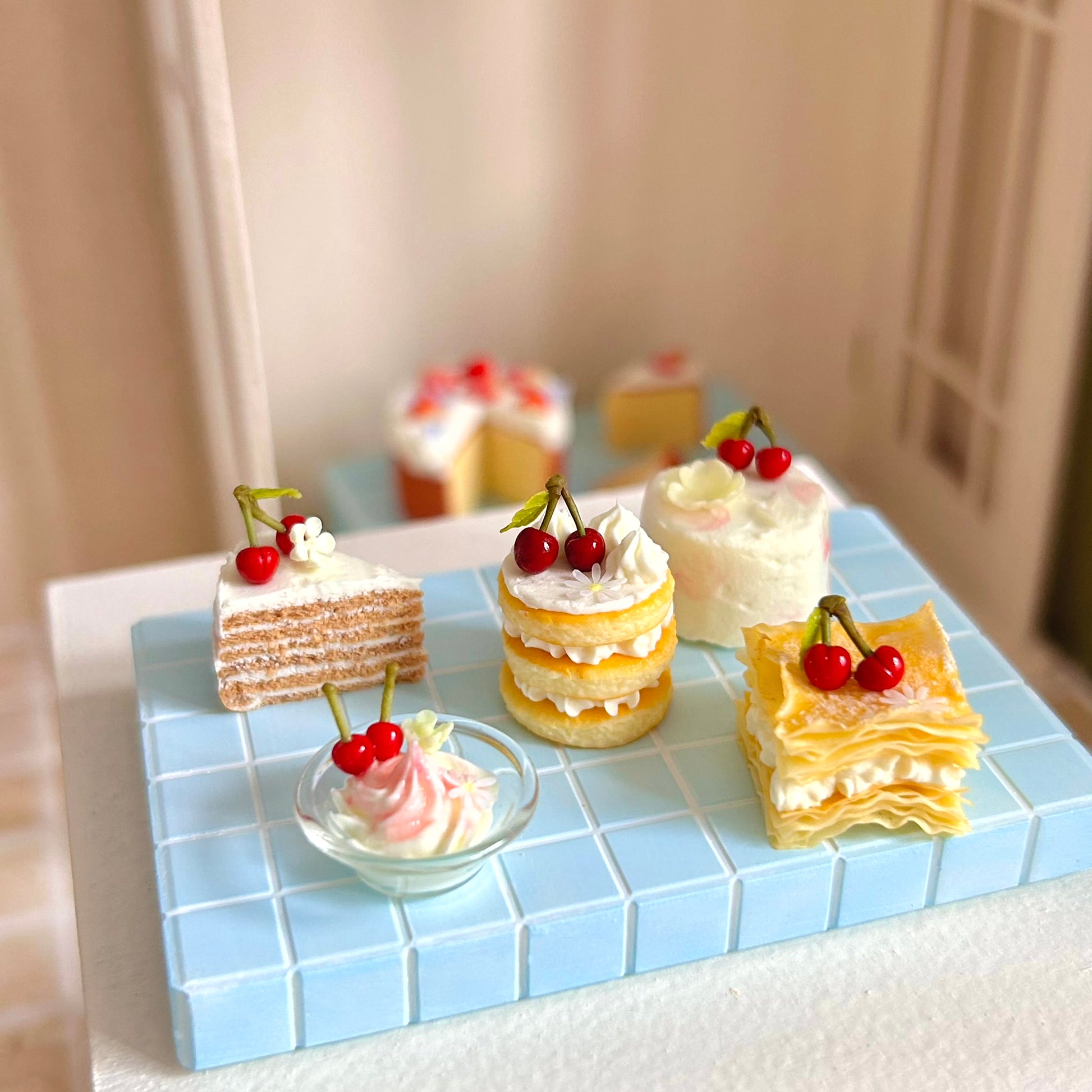 dollhouse dessert scene with realistic miniature puff pastry