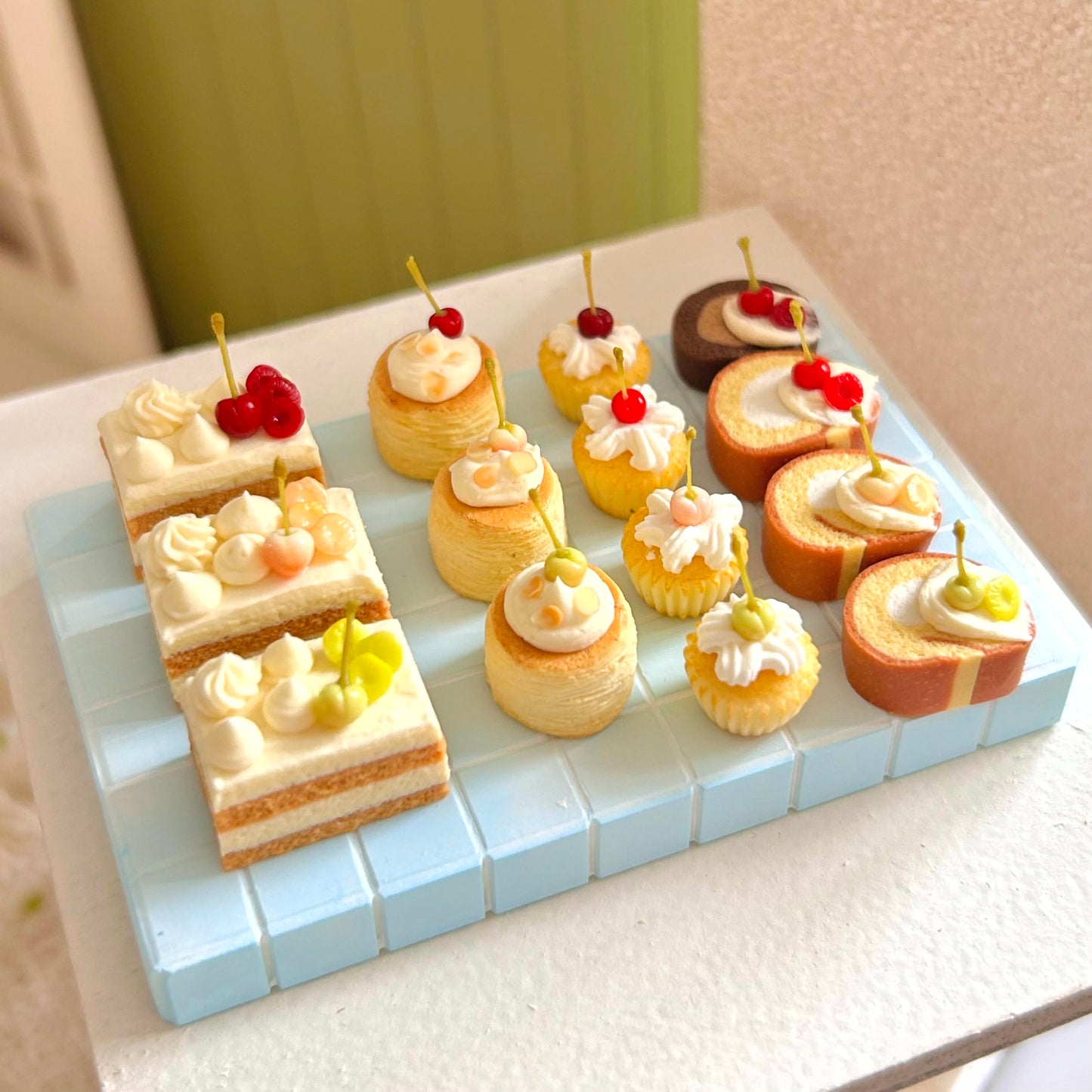 miniature dessert display with handmade cherry cake slice