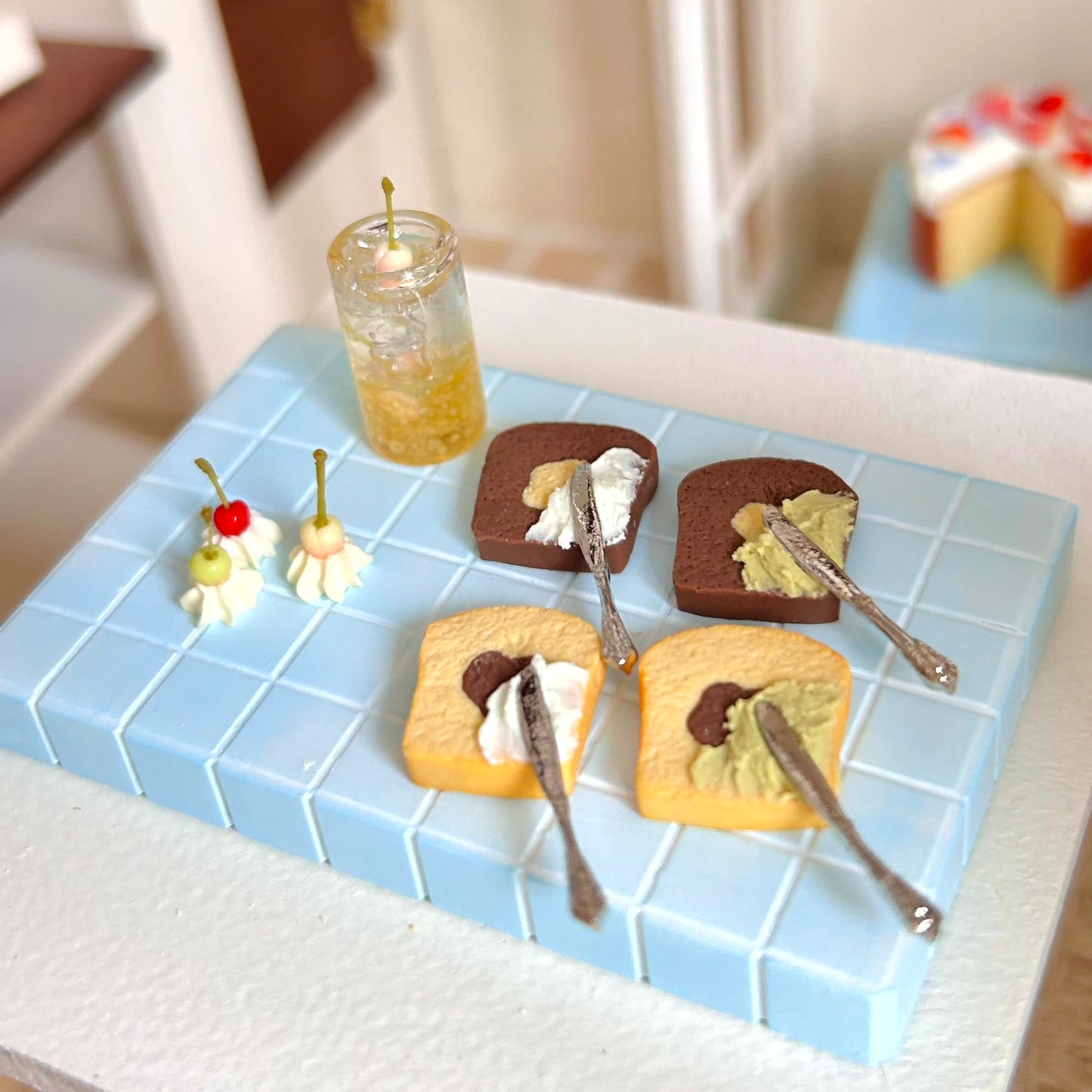 miniature bakery scene featuring handmade pound cake slice with cream