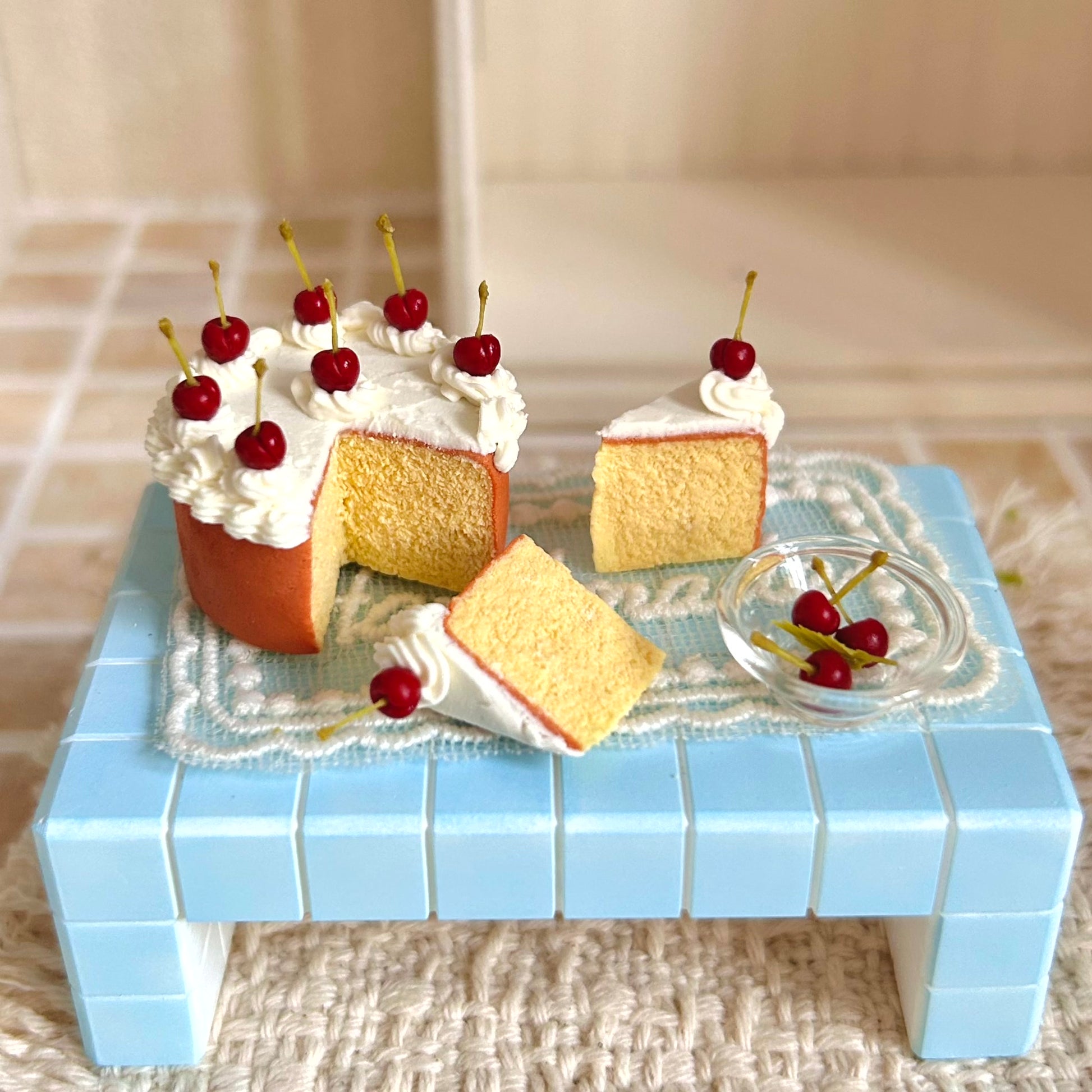 handmade miniature cherry chiffon cake set with piped cream decoration