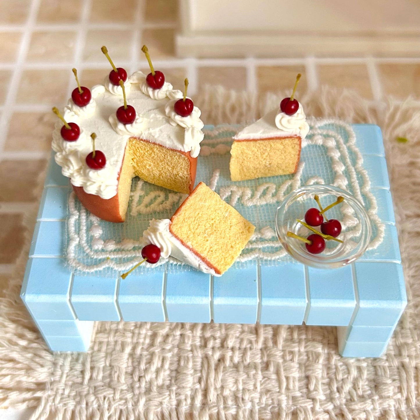miniature cherry chiffon cake with separate slice pieces and whipped cream