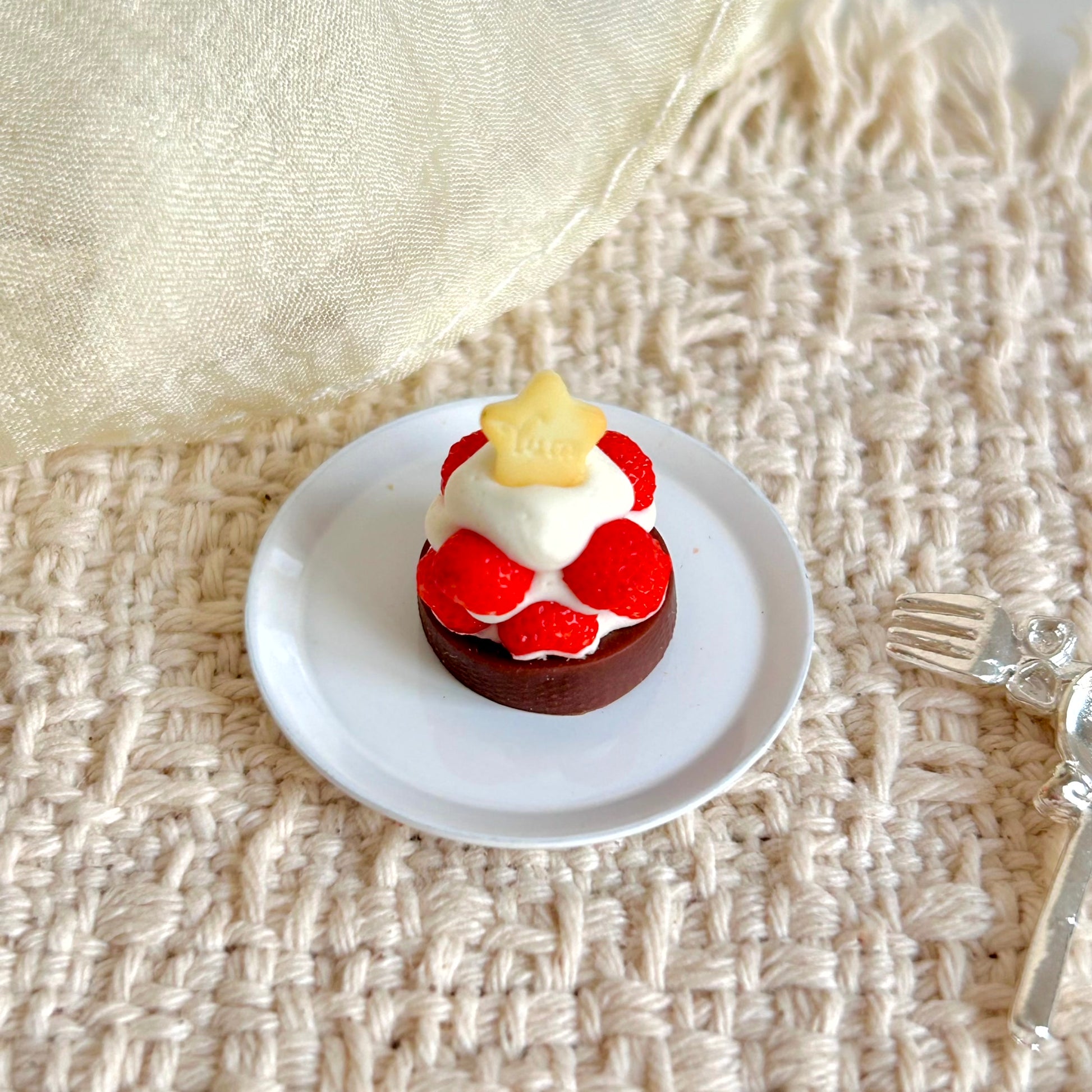 miniature chocolate strawberry tart with handmade cream and fruit decoration