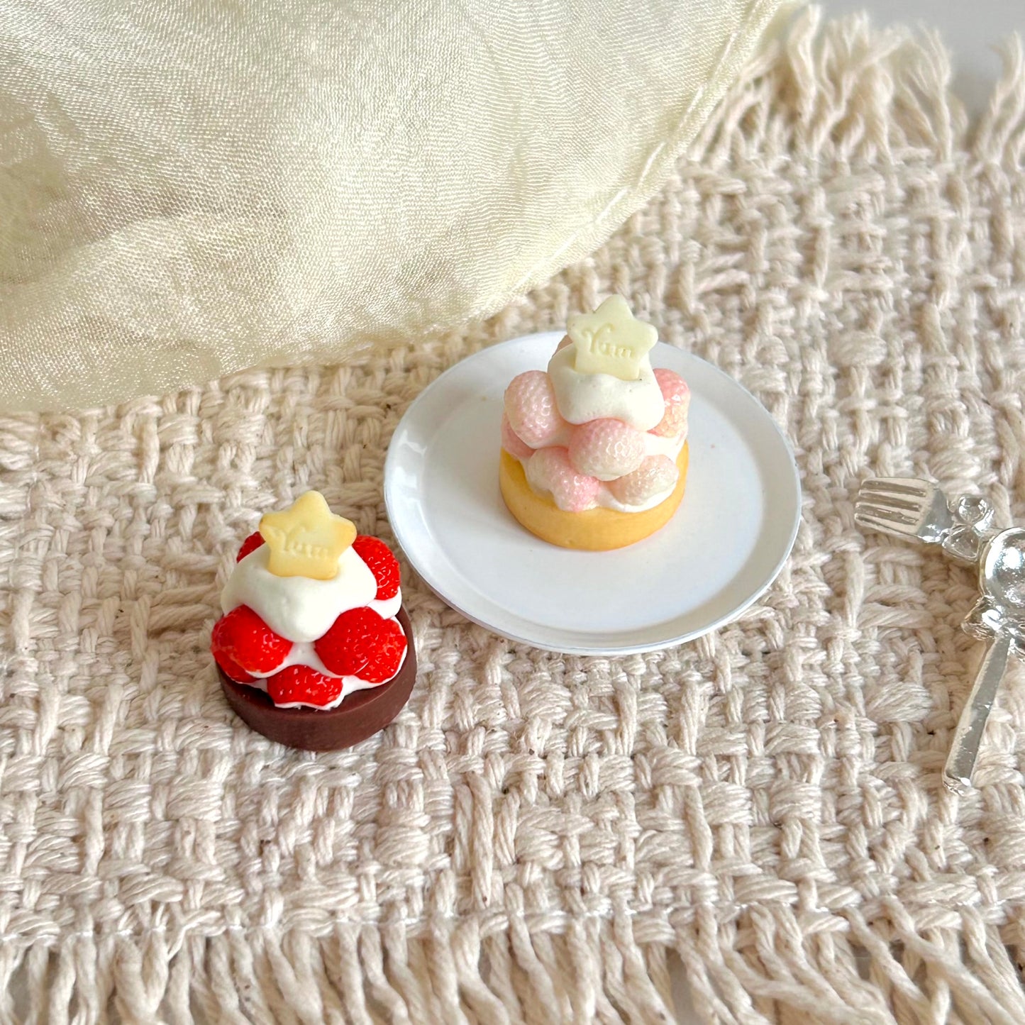 realistic miniature strawberry tart with cream and cookie decoration