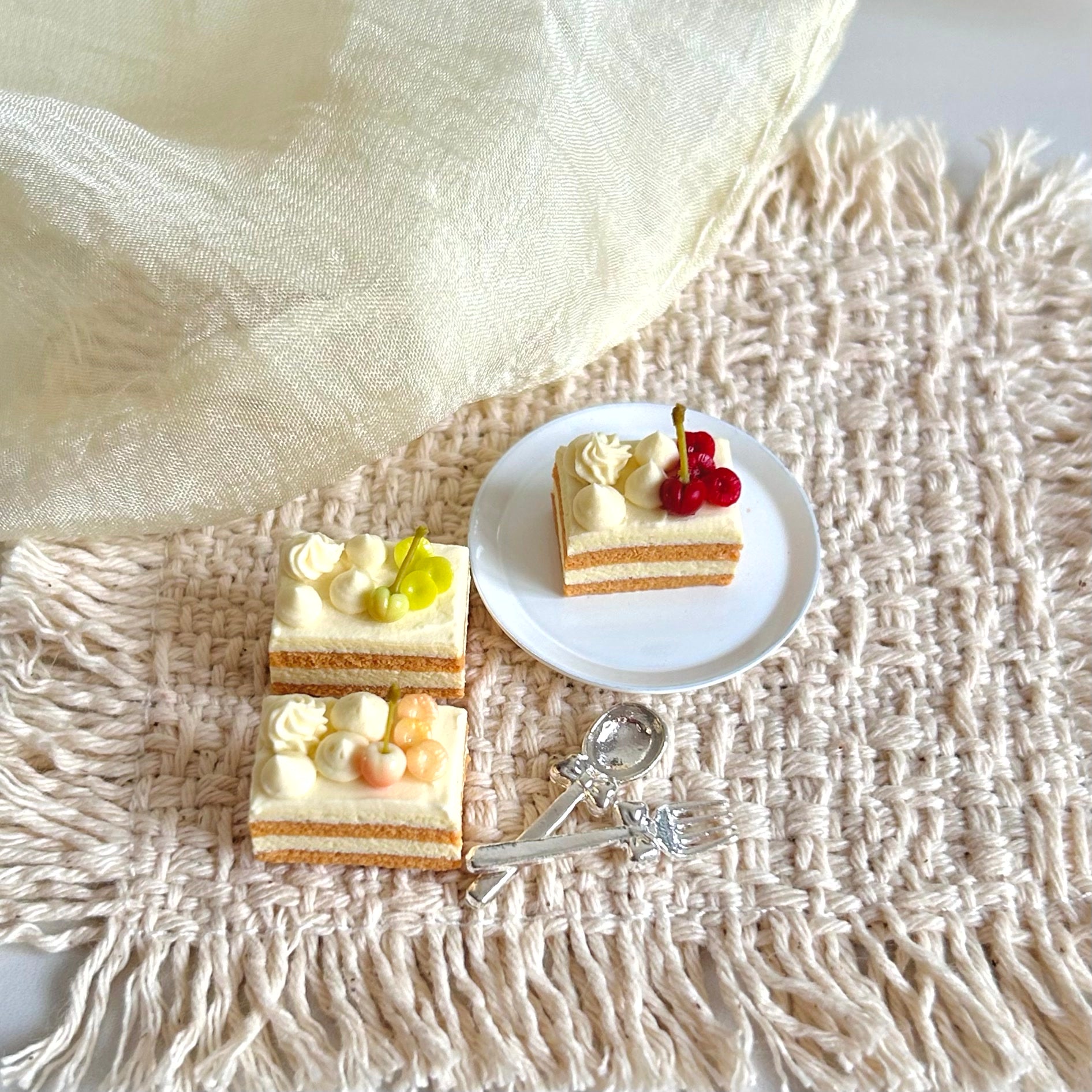 miniature cherry cake slice with cream filling and fruit decoration