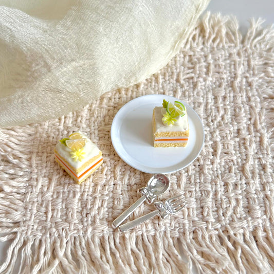 handmade miniature lemon and lime cake slice realistic dessert
