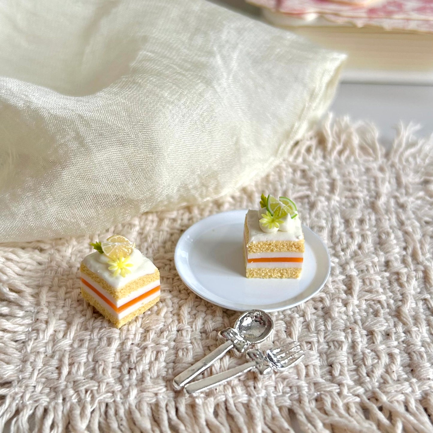 miniature lemon cake slice with cream and citrus filling details
