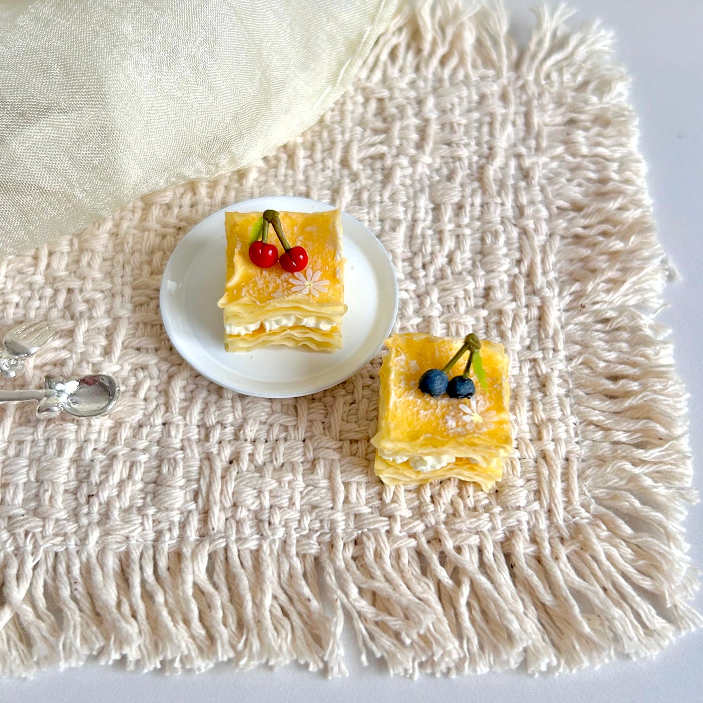 handmade miniature cherry and blueberry mille feuille dessert