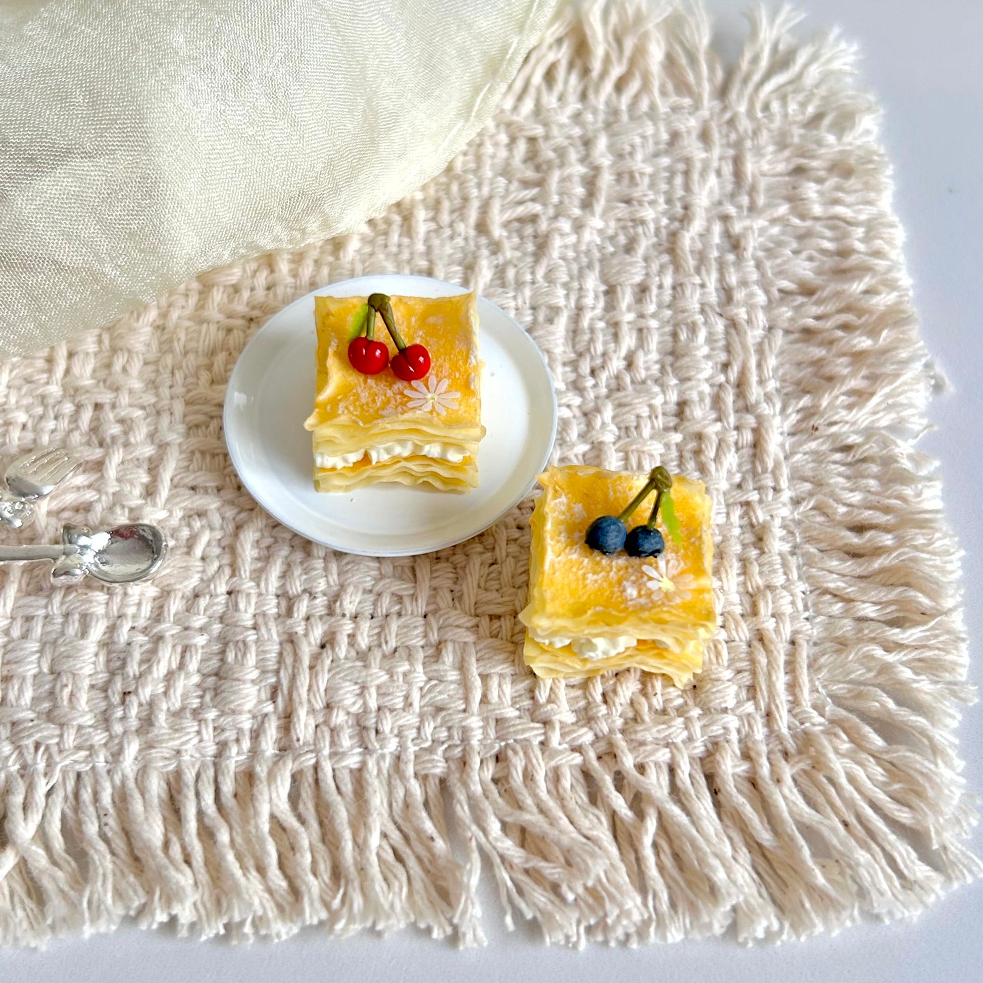 handmade miniature cherry and blueberry mille feuille dessert