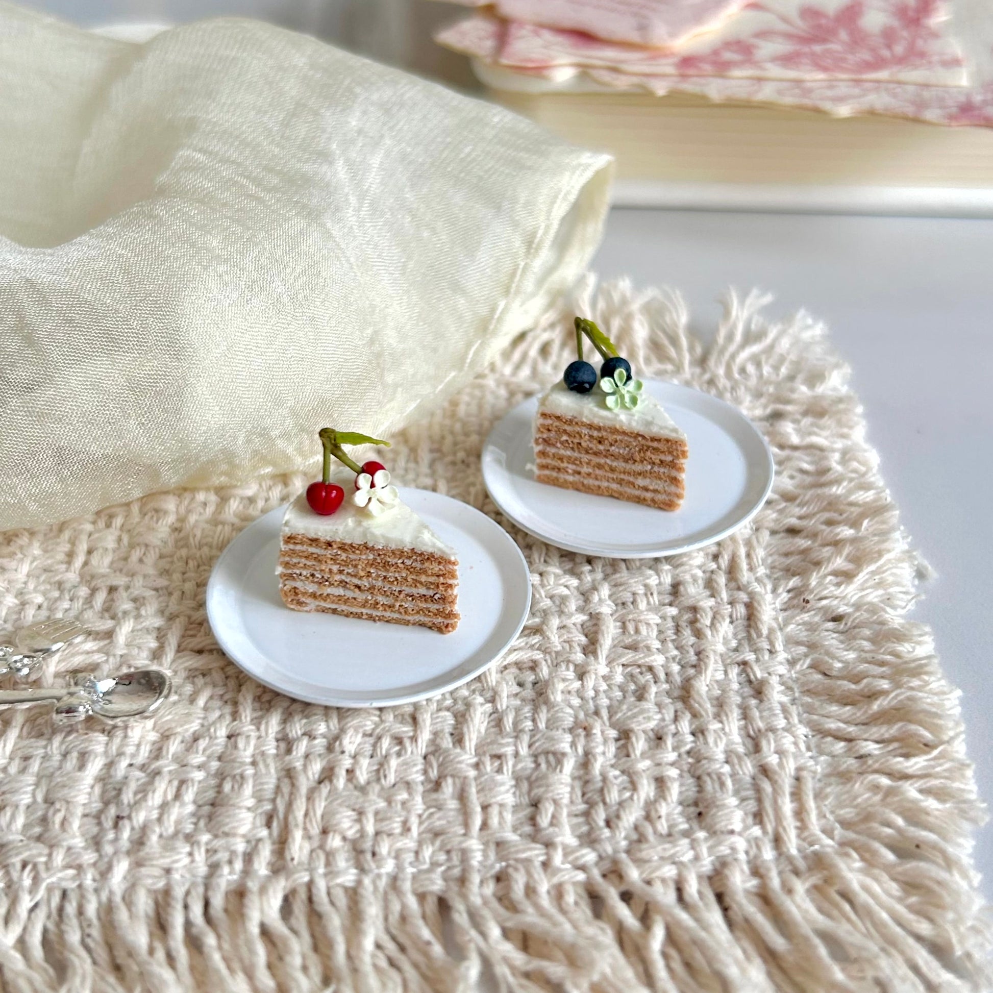 handmade miniature vintage cherry and blueberry layer cake slice