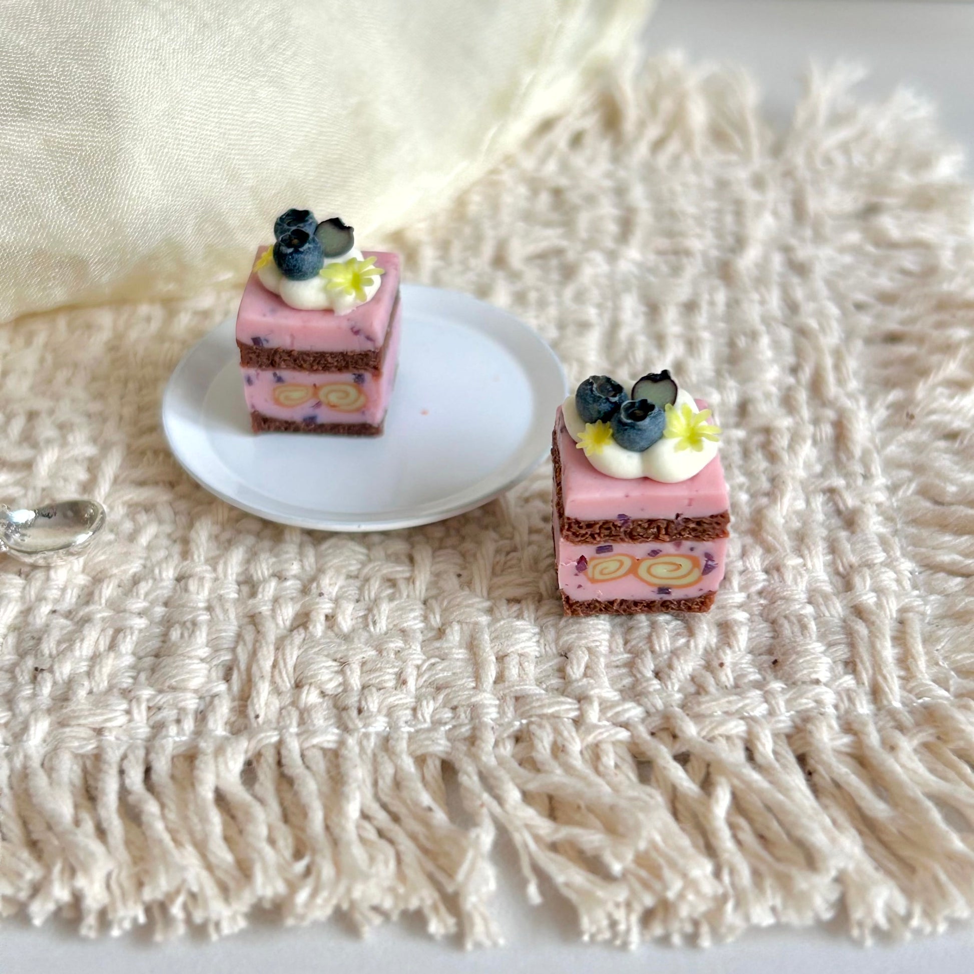 handmade miniature blueberry cube layer cake with cream filling
