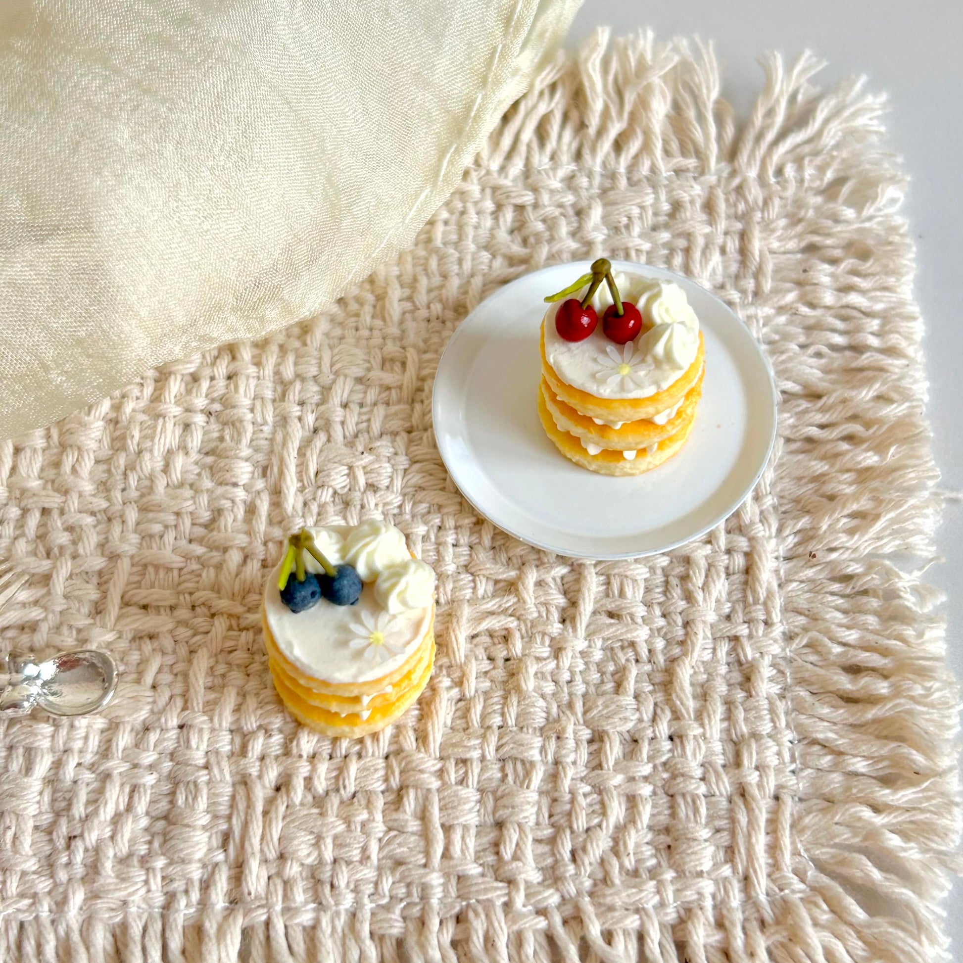 mini triple layer sponge cake miniature with cherry topping