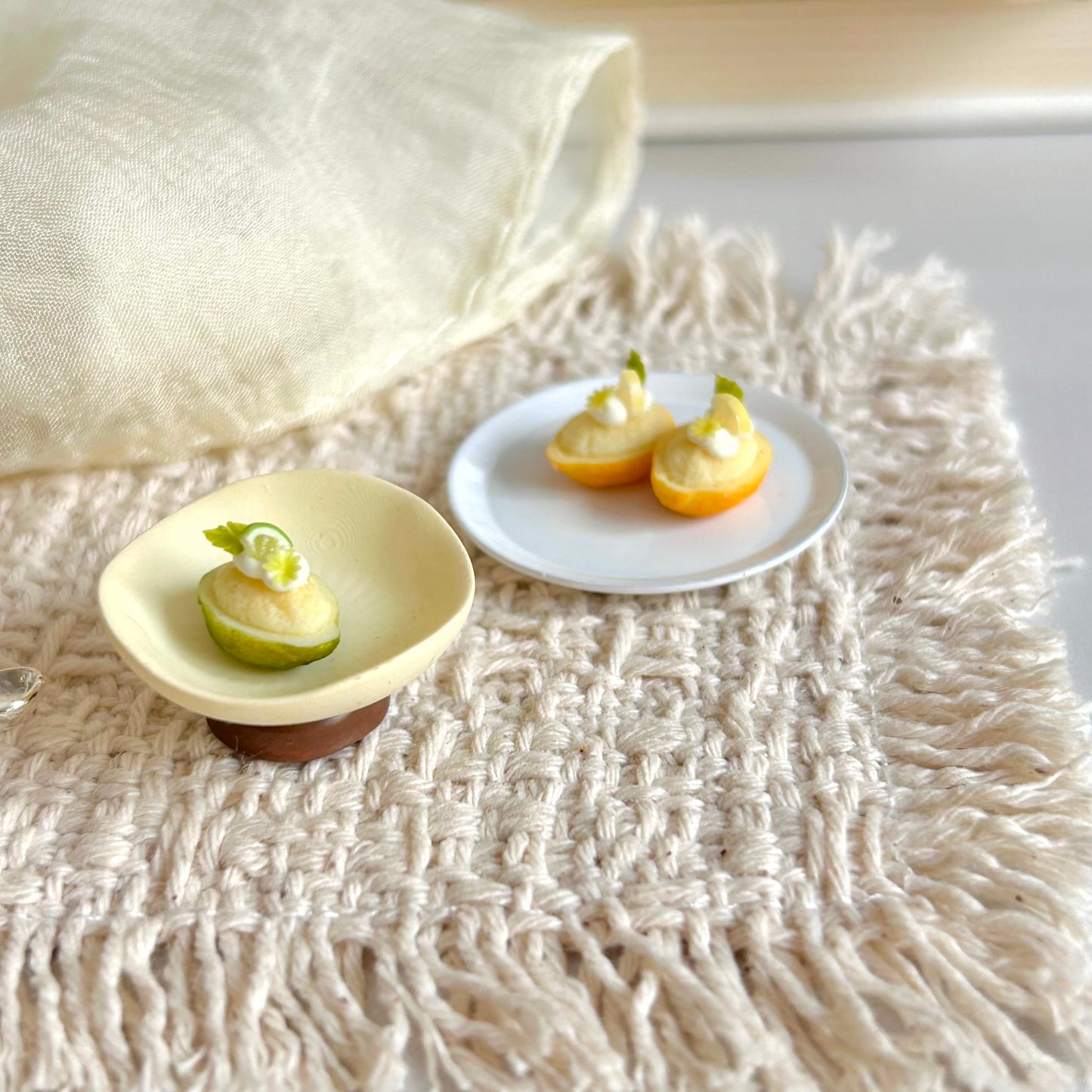 handmade miniature lemon boat dessert with cake and cream topping