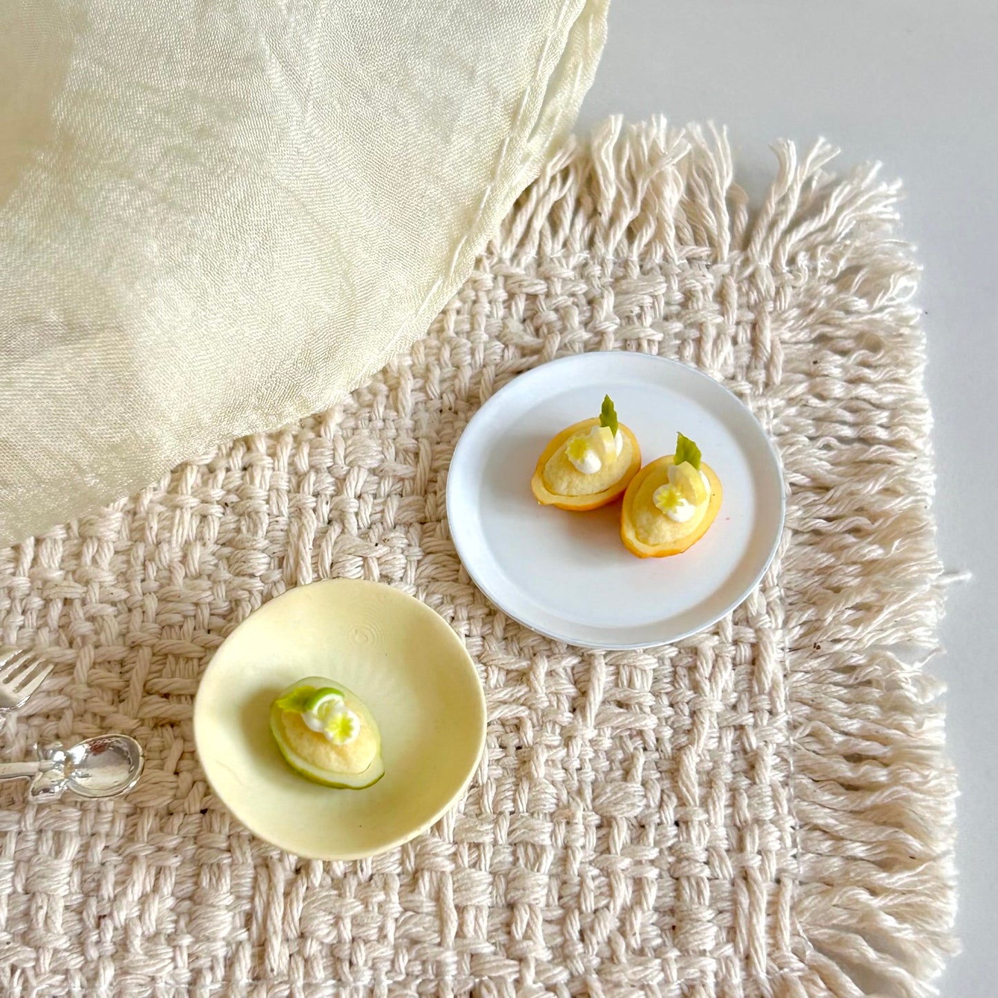 miniature lemon and lime dessert with clay fruit decorations
