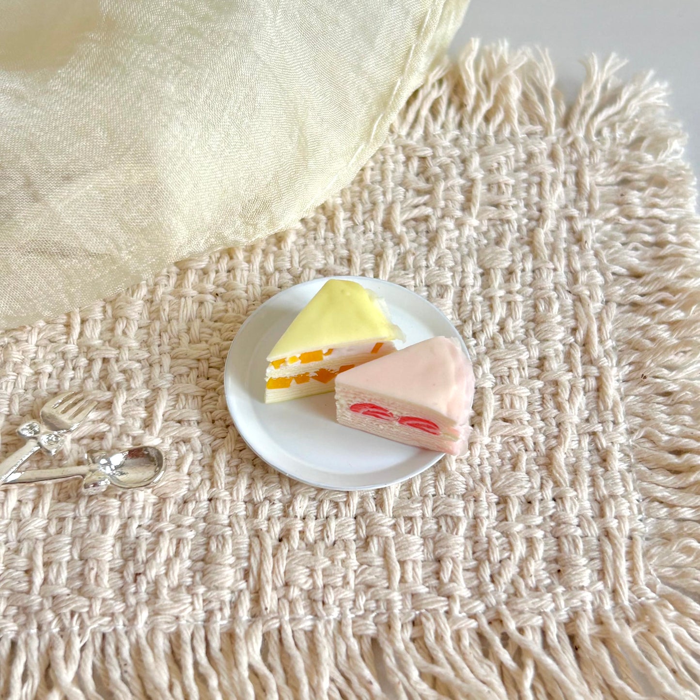miniature layered crepe cake slices with fruit filling and cream layers