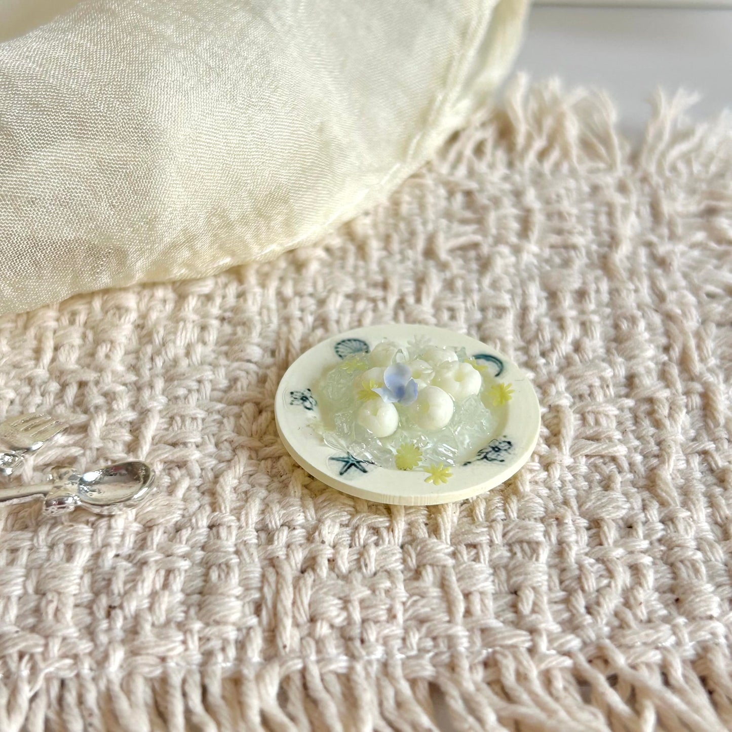 handmade miniature ice lychee dessert on a 3D printed resin plate