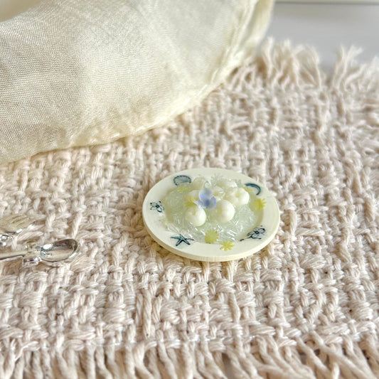 handmade miniature ice lychee dessert on a 3D printed resin plate