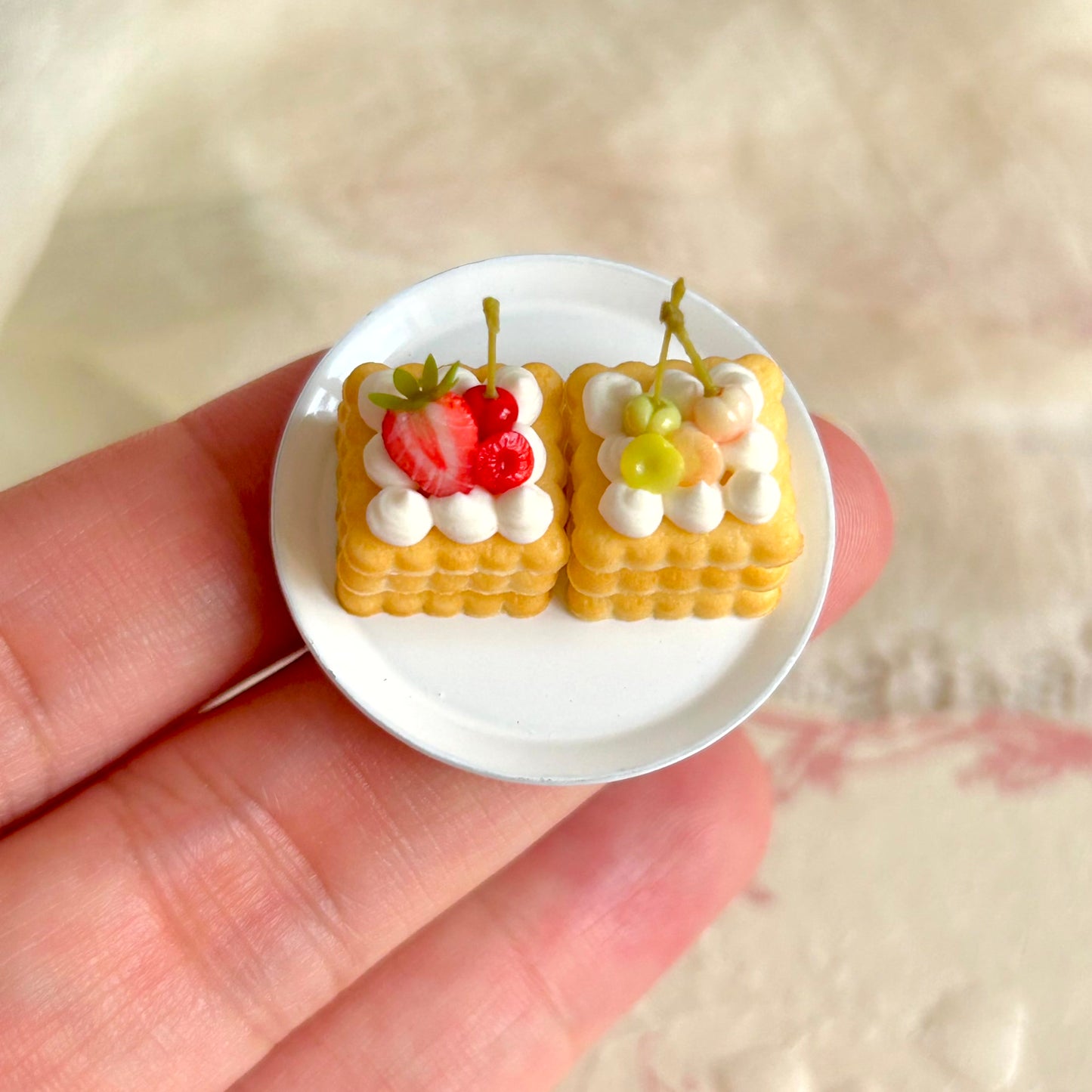 realistic miniature layered cake with cream and fruit details